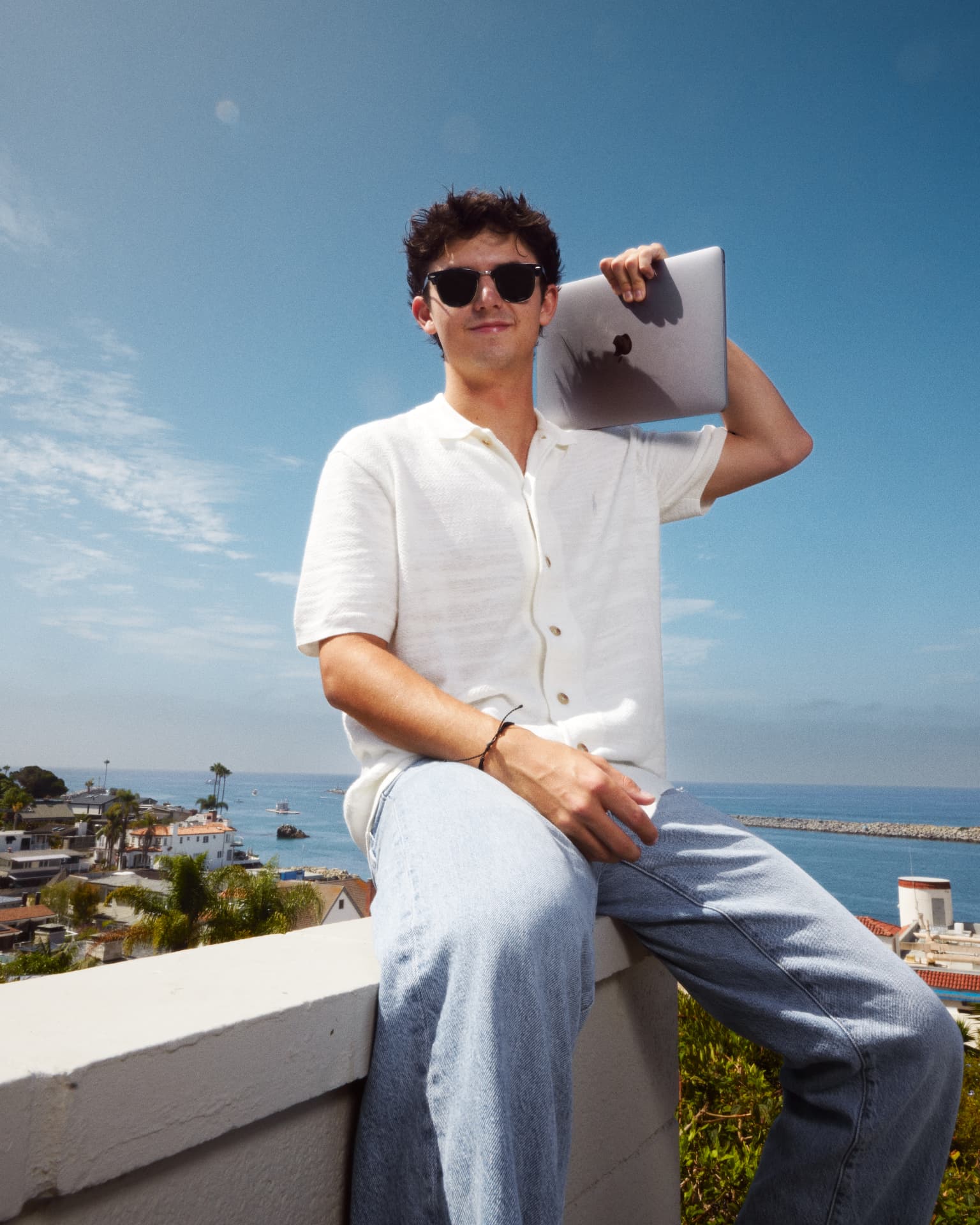 James Brewster holding a laptop